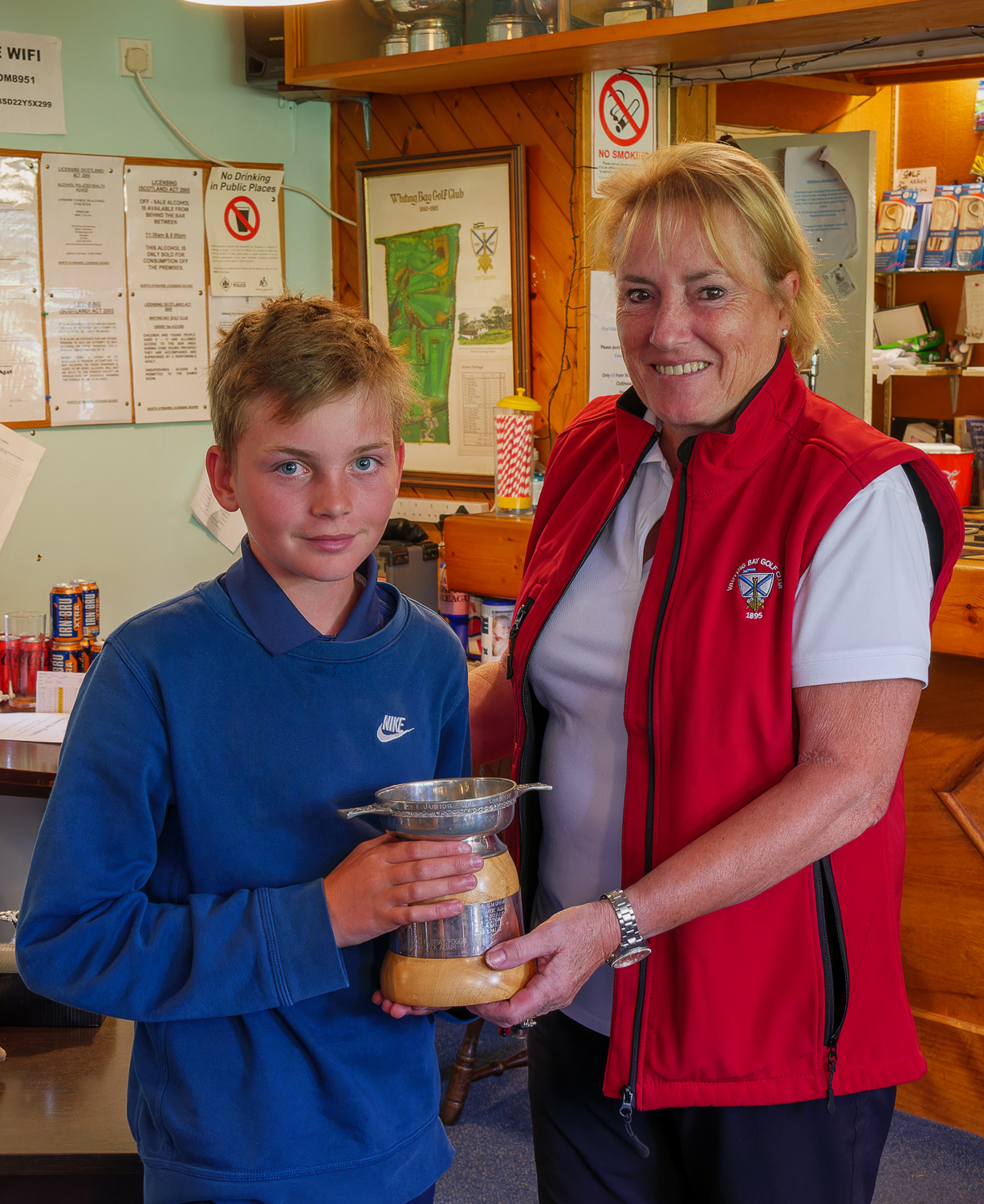 2023 WBGC Junior Open Champion, Rory Stewart receives his trophy from club captain, Doreen Mainds